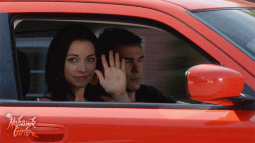 Woman On Car Waving Goodbye GIF