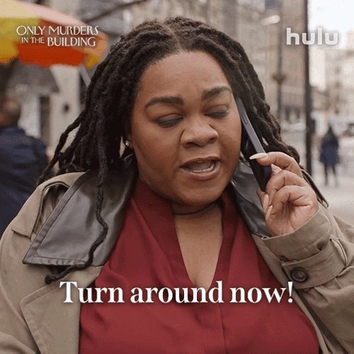 Woman on Cell Phone Saying Turn Around Now