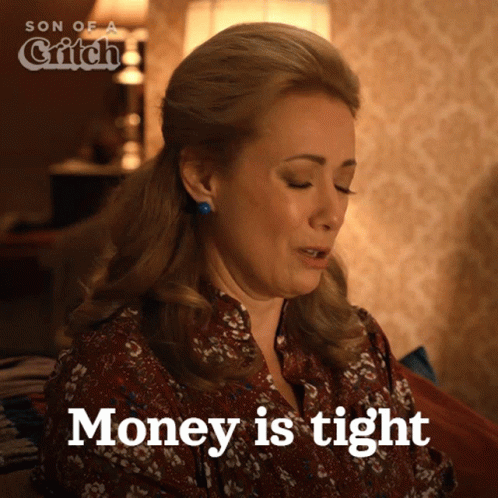 Woman on Couch Saying Money Is Tight
