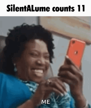 Woman on Couch Smiling at Phone