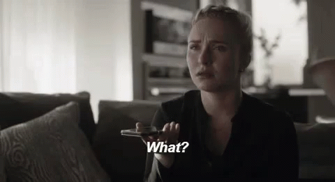Woman On Couch Talking On Cell Phone Saying What GIF