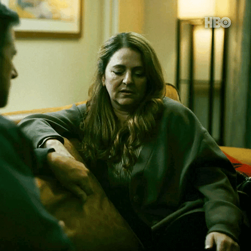Woman on Couch Talking to Man With HBO