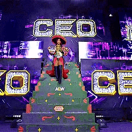 Woman on Green Staircase in Front of CEO Screen