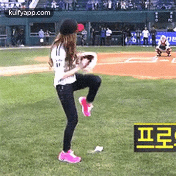 Woman on One Leg with Baseball Glove on Field