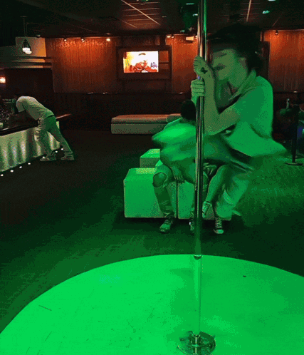 Woman on Pole in Green Room