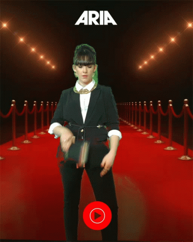 Woman on Red Carpet in Front of YouTube Music Sign