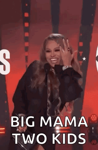 Woman On Stage Giving Thumbs Up With Microphone GIF