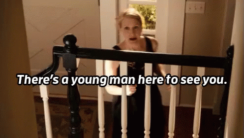 Woman On Staircase There's A Young Man Here To See You GIF