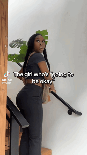 Woman on Stairs Saying The Girl Who's Going to Be Okay
