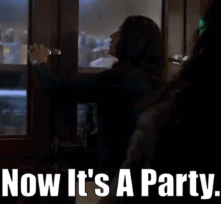 Woman Opening Door Saying Now It's a Party