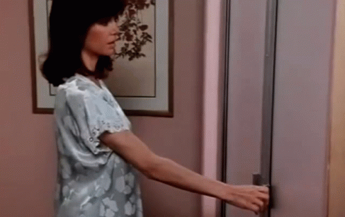 Woman Opening Refrigerator Door