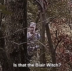 Woman Peeking Behind Tree Blair Witch