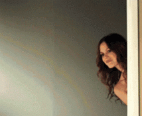 Woman Peeking Out Doorway