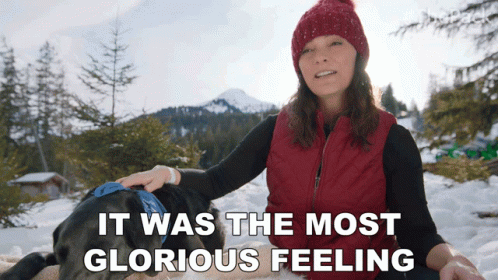 Woman Petting Dog in Snow Glorious Feeling