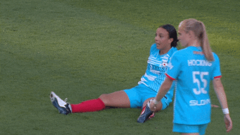 Woman Player Sit Down On Grass GIF