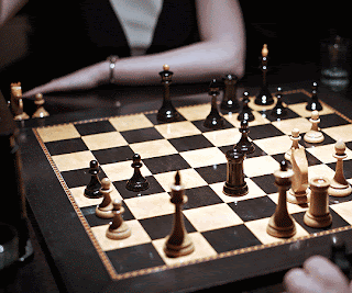 Woman Playing Chess GIF