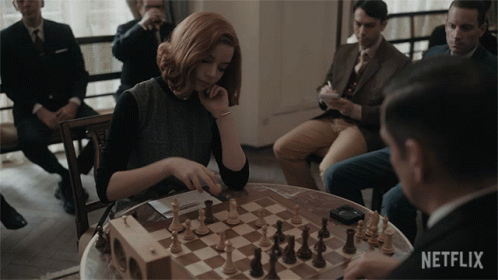 Woman Playing Chess With Netflix Logo GIF