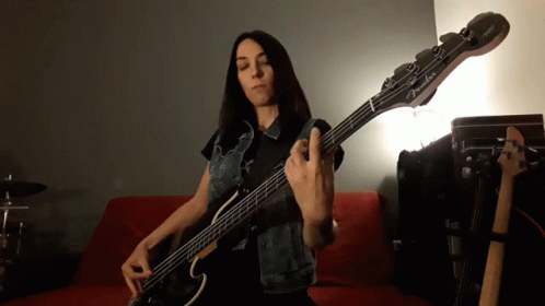 Woman Playing Fender Bass Guitar