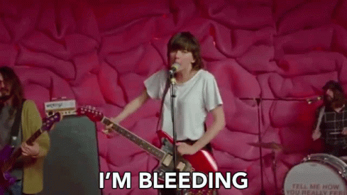 Woman Playing Guitar and Singing