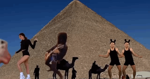 Woman Playing Guitar in Front of Pyramid
