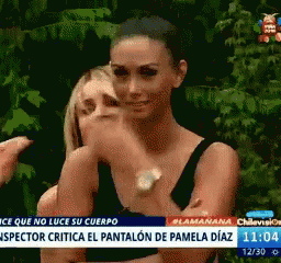 Woman Pointing at Another Woman