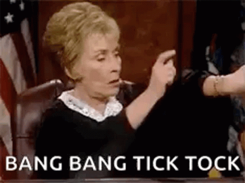 Woman Pointing at Another Woman While Another Woman Holds Hand Up