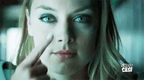 Woman Pointing Finger at Nose