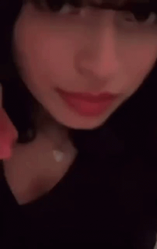 Woman Pointing To Forehead GIF