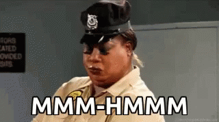 Woman Police Uniform Saying Mmmm Hmmm GIF