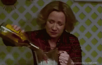Woman Pouring Drink Into Glass