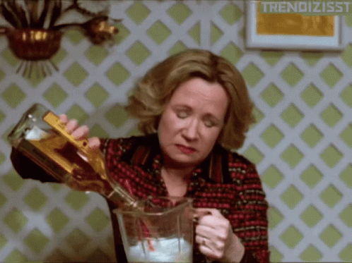 Woman Pouring Drink Into Pitcher GIF