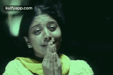 Woman Praying In Dark Room GIF