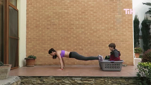 Woman Push Ups Near Laundry Basket