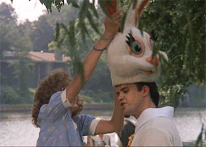 Woman Putting Bunny Head on Man
