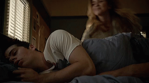 Woman Putting Hand On Sleeping Man's Chest GIF