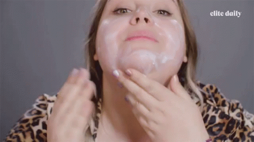 Woman Putting Lotion On Face And Neck GIF