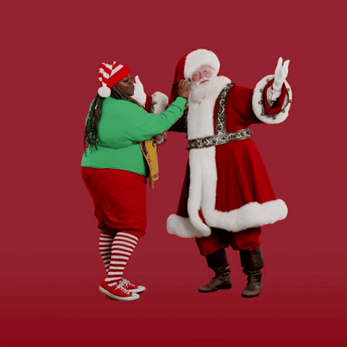 Woman Putting Something On Santa's Face GIF
