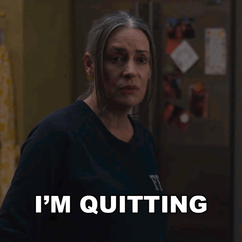 Woman Quitting in Front of Refrigerator