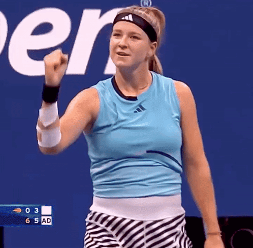Woman Raising Fist in Adidas Headband