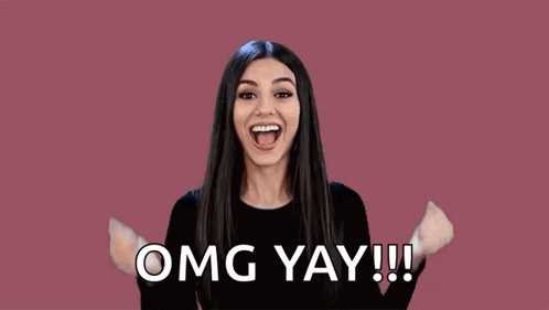 Woman Raising Fist Saying Omg Yay GIF