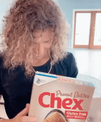 Woman Reading Chex Peanut Butter Box