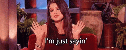 Woman Red Couch Hands Up I'm Just Sayin GIF