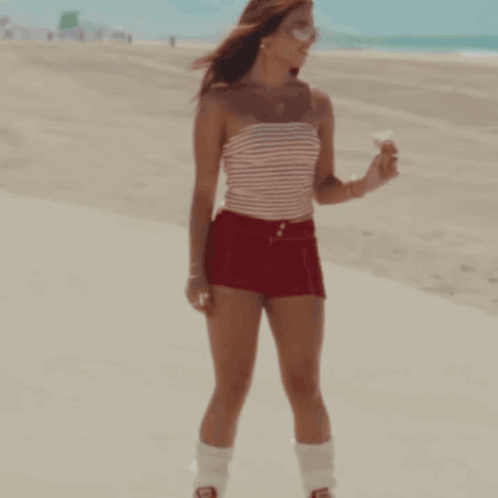 Woman Red Shorts Striped Top Holding Ice Cream GIF