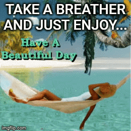 Woman Relaxing in Hammock Over Ocean