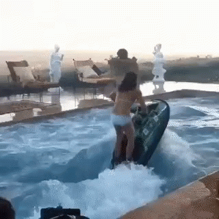 Woman Riding Jet Ski into Pool