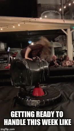 Woman Riding Mechanical Bull Getting Ready to Handle This Week Like