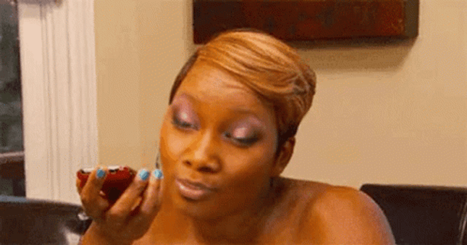 Woman Rolls Eyes While Talking To Her Phone GIF