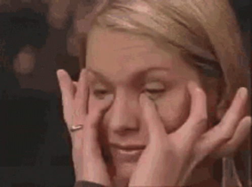 Woman Rubbing Eyes With Ring