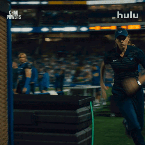 Woman Running on Field With Hulu