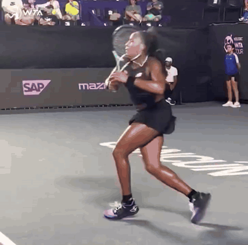 Woman Running on Tennis Court With Sap Sign